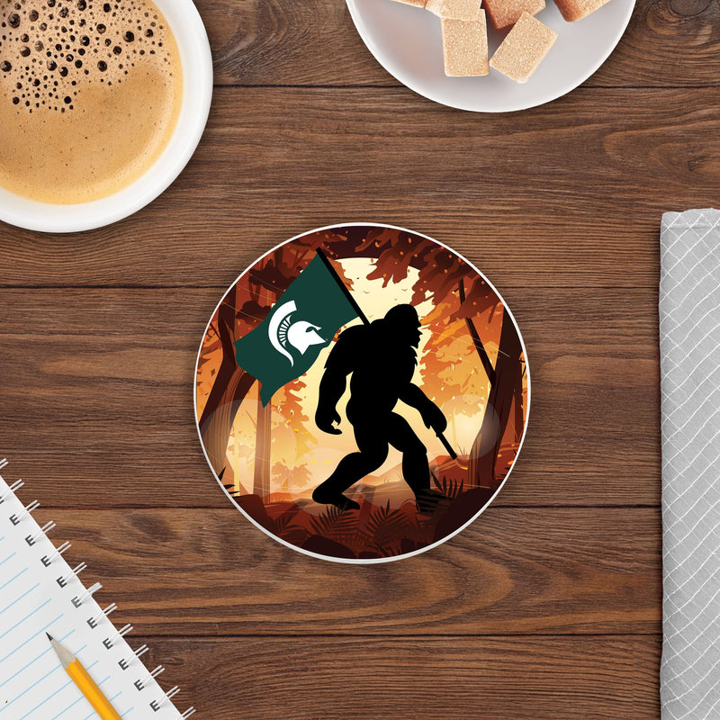 Load image into Gallery viewer, Fan Creations Michigan State University -  4 inch Ceramic Big Foot Flag Car Coaster
